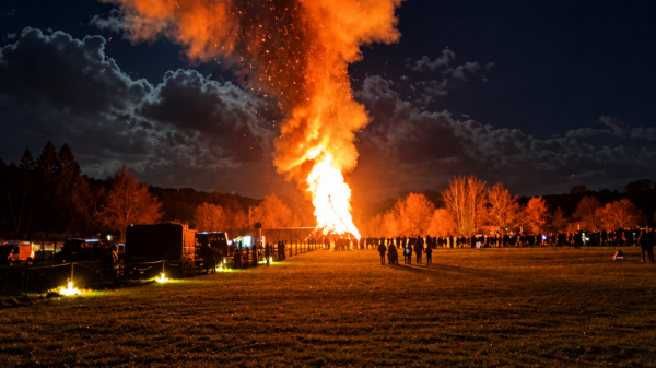 A towering bonfire lights up a field on Bonfire Night